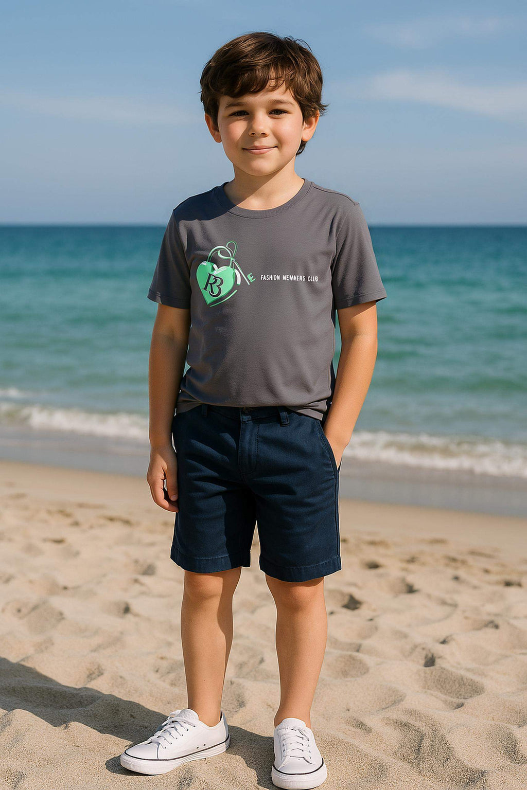 Boy wearing Key to My Heart boys edition casual t-shirt with heart and key print at the beach