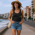 woman wearing black Green Rose Edition classic tank top with green rose design walking outdoors on seaside path