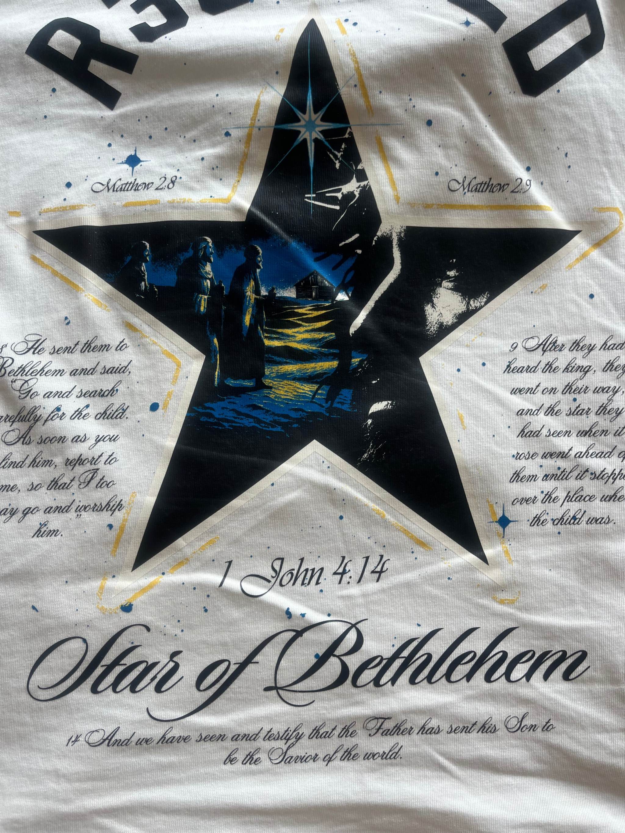 Star of Bethlehem tee with oversized fit, front star logo, and back illustration of Jesus and wise men with Bible verses